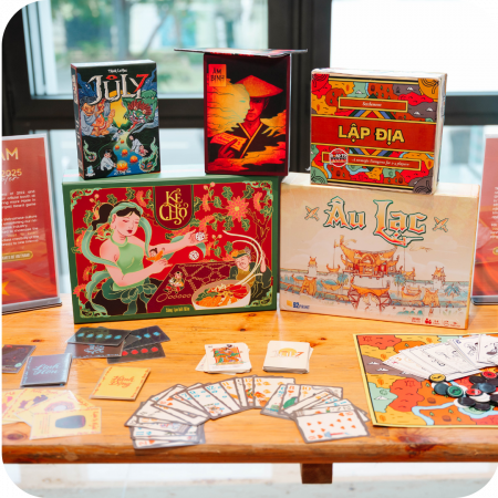 Different Vietnamese board games are stacked on a table.